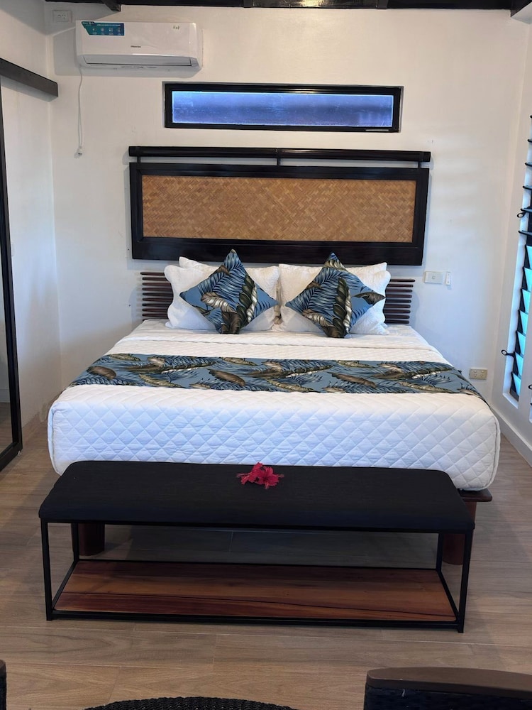 The Luxury Villa — a spacious room with a king bed